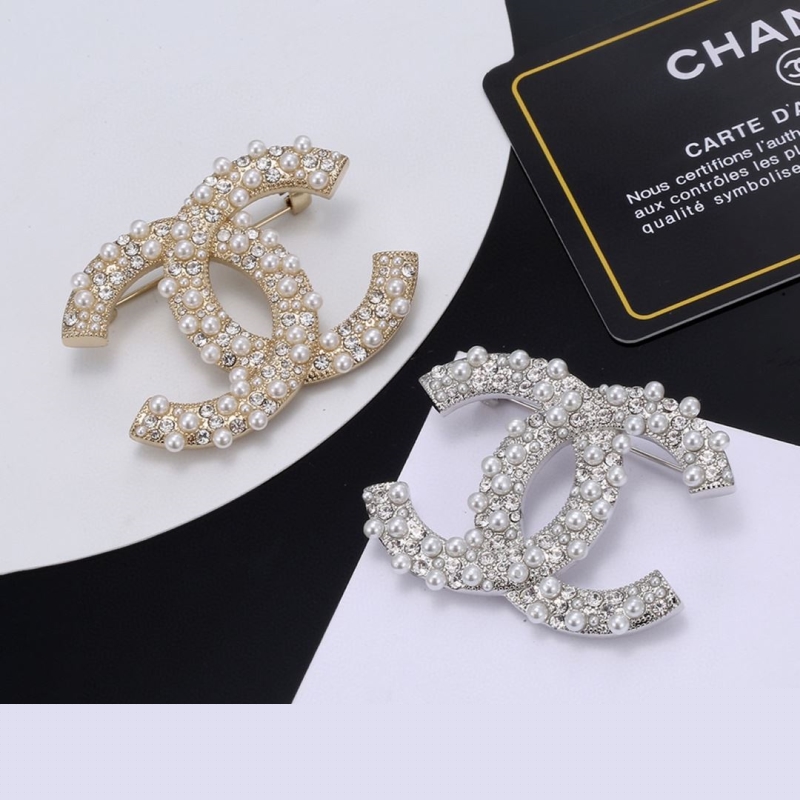 Ch*el brooches